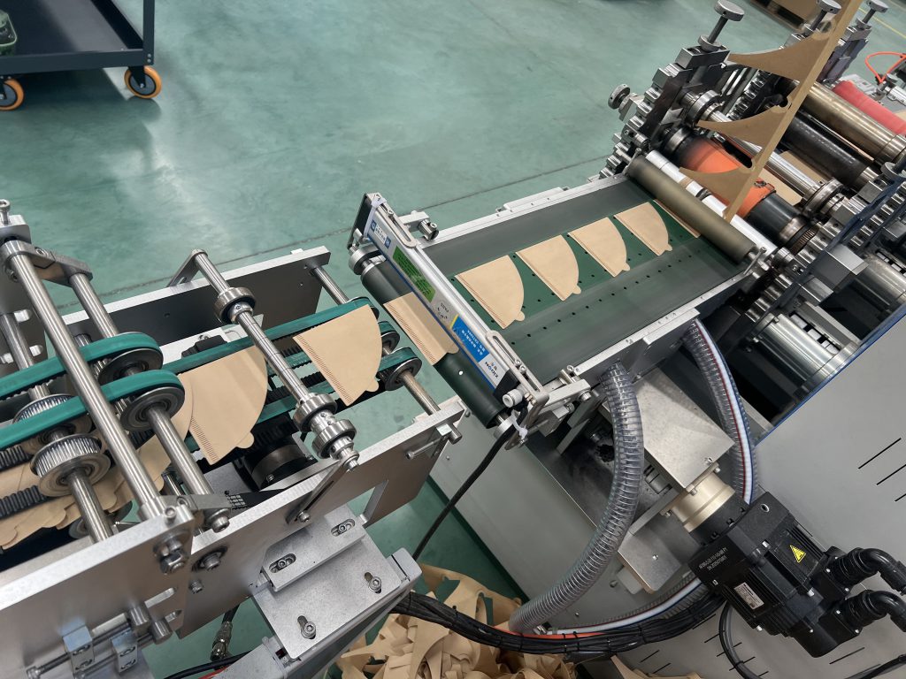 Automated coffee filter paper die-cutting machine operating in factory